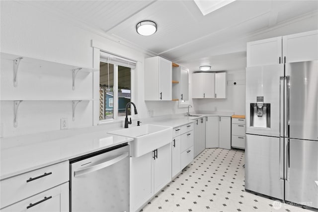 607 37th St SE Unit 92, Auburn, WA 98002 - kitchen featuring a sink, stainless steel appliances, open shelves, white cabinetry, and light floors