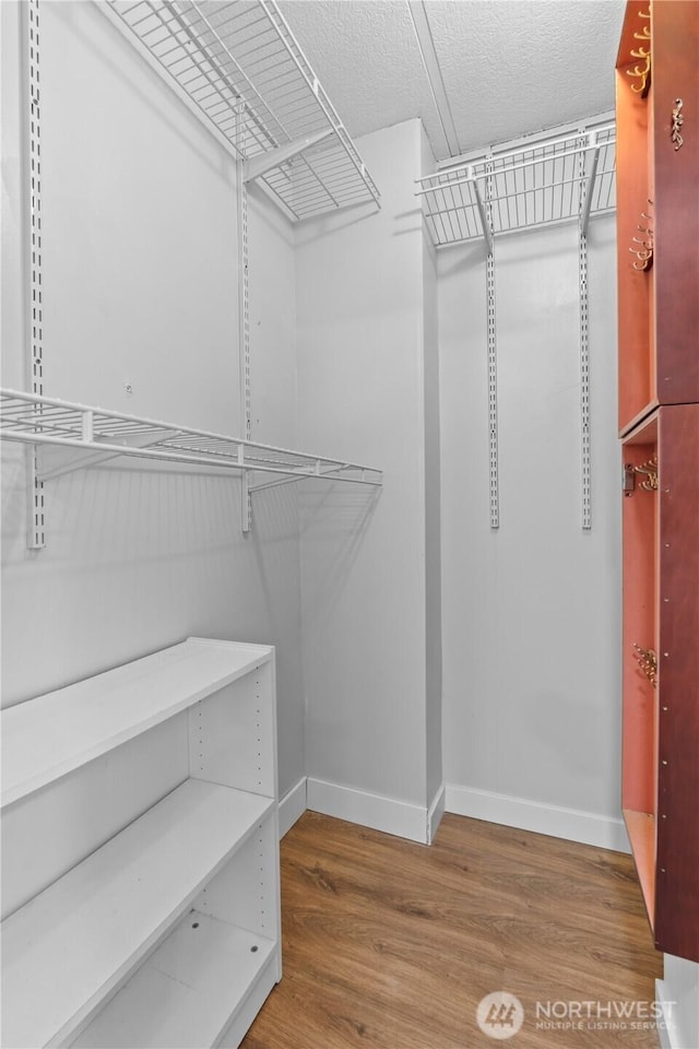 607 37th St SE Unit 92, Auburn, WA 98002 - spacious closet featuring wood finished floors