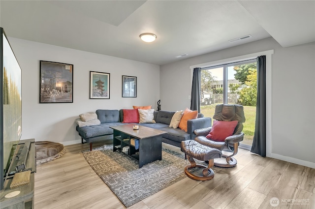 1300 Rhododendron Ct NE, Olympia, WA 98516 - living room featuring light wood-style floors and baseboards