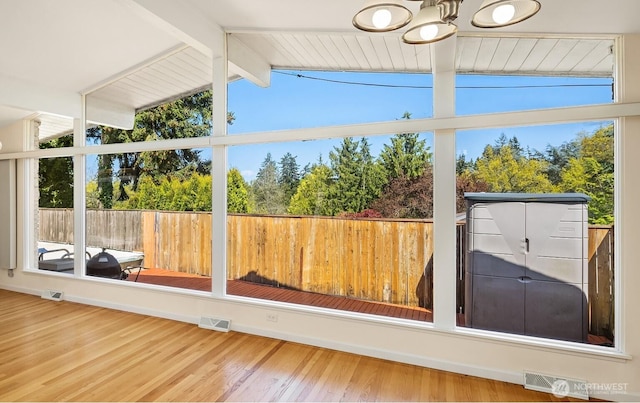 9750 SE 41st St, Mercer Island, WA 98040 - unfurnished sunroom with visible vents, plenty of natural light, and vaulted ceiling with beams