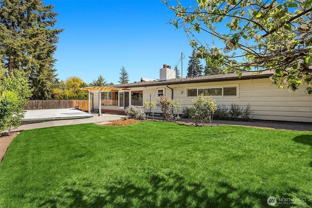 9750 SE 41st St, Mercer Island, WA 98040 - rear view of property with a patio area, fence, a yard, and a chimney