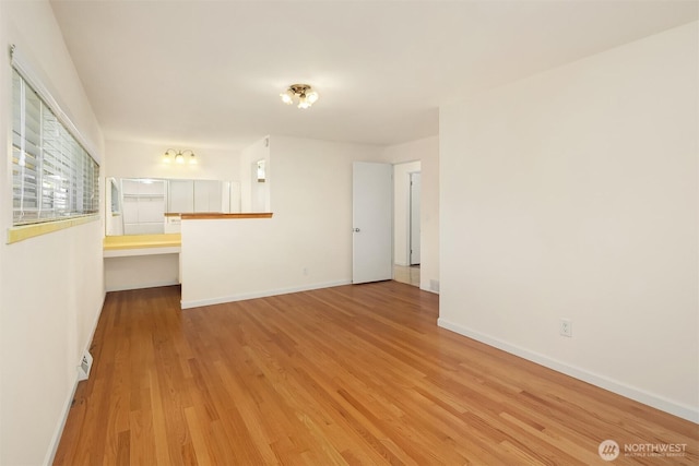 9750 SE 41st St, Mercer Island, WA 98040 - spare room featuring baseboards and wood finished floors