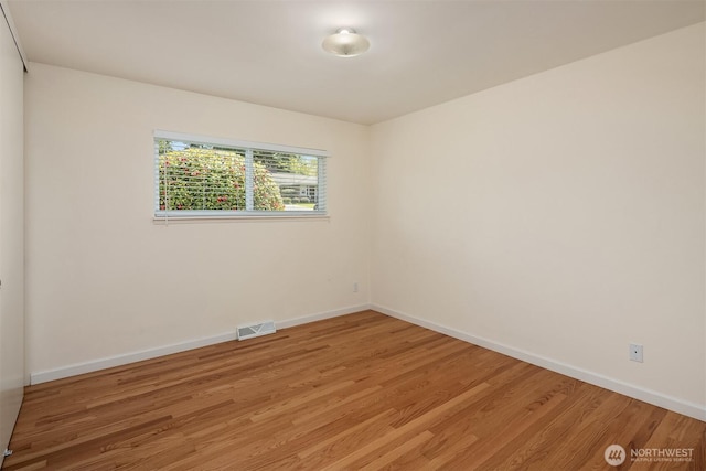 9750 SE 41st St, Mercer Island, WA 98040 - empty room with light wood-style floors, baseboards, and visible vents