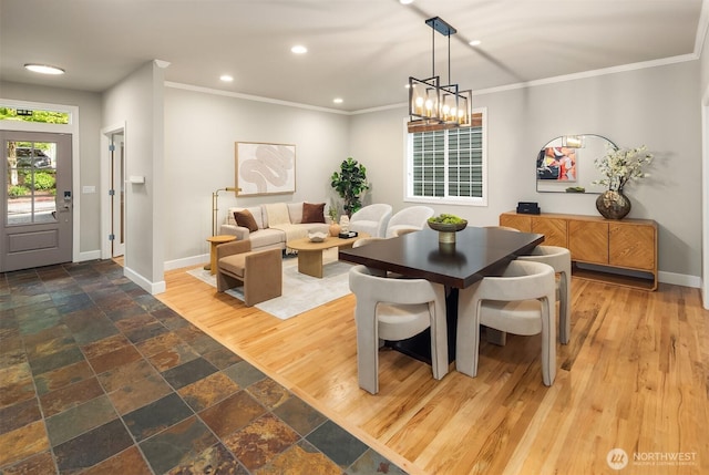 dining room with baseboards, ornamental molding, recessed lighting, and stone finish flooring