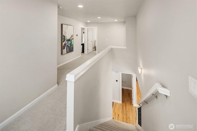 stairs featuring baseboards and recessed lighting
