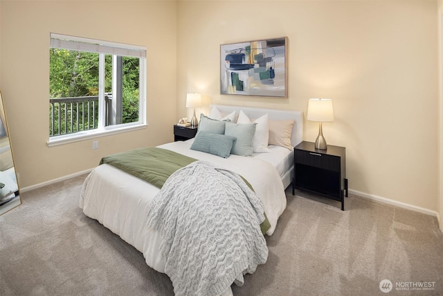 bedroom with carpet and baseboards