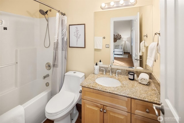 full bathroom with shower / bath combo, toilet, and vanity
