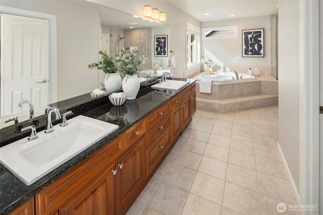 bathroom with tile patterned floors, a bath, double vanity, tiled shower, and recessed lighting