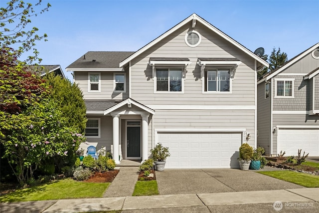 traditional-style house with concrete driveway and a garage