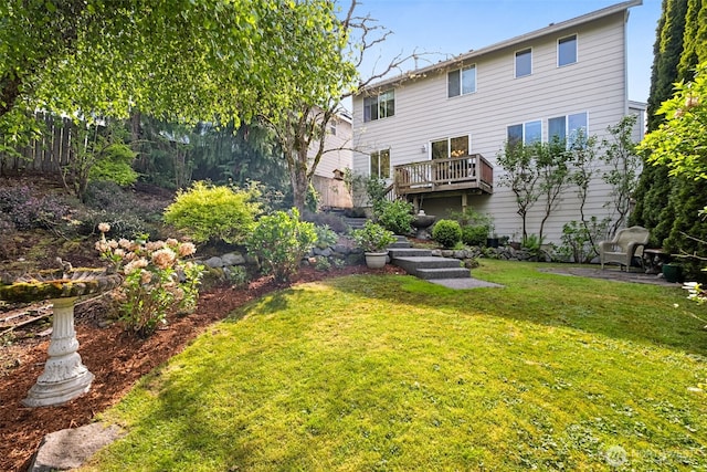 back of property with a yard and fence