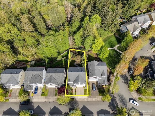 birds eye view of property with a residential view