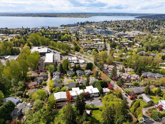 bird's eye view featuring a residential view and a water view