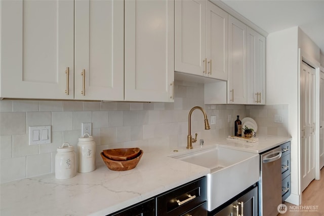 321 Bellevue Way SE Unit 401, Bellevue, WA 98004 - kitchen with white cabinetry, light stone countertops, and a sink