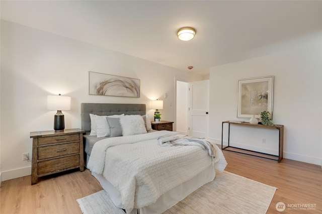 321 Bellevue Way SE Unit 401, Bellevue, WA 98004 - bedroom with light wood-type flooring and baseboards