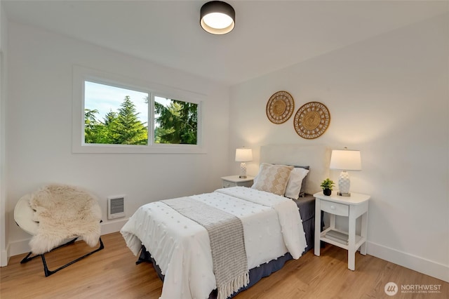 321 Bellevue Way SE Unit 401, Bellevue, WA 98004 - bedroom with baseboards, visible vents, and light wood finished floors
