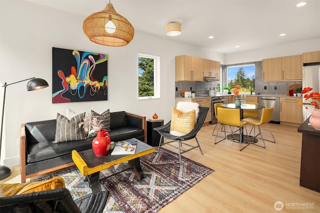 3650 51st Ave SW Unit B, Seattle, WA 98116 - living area with light wood-style floors and recessed lighting
