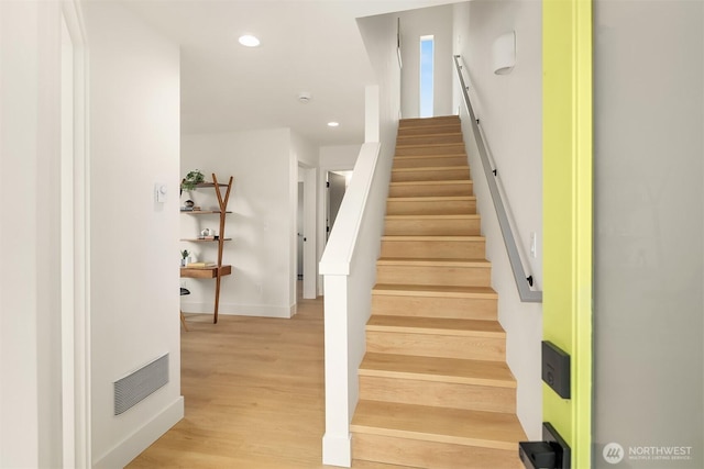3650 51st Ave SW Unit B, Seattle, WA 98116 - stairway with baseboards, recessed lighting, and wood finished floors