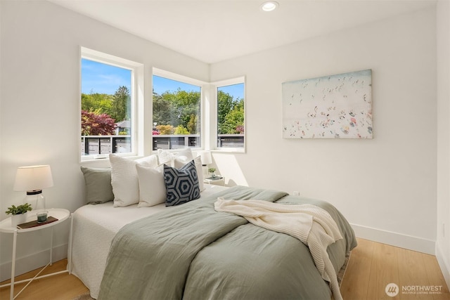 3650 51st Ave SW Unit B, Seattle, WA 98116 - bedroom featuring baseboards, wood finished floors, and recessed lighting
