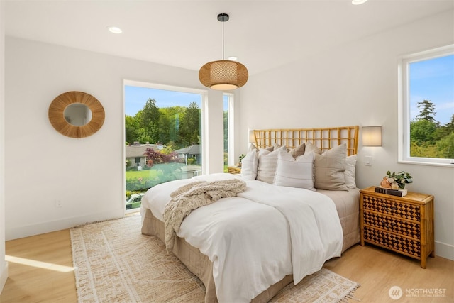3650 51st Ave SW Unit B, Seattle, WA 98116 - bedroom with access to outside, light wood-type flooring, multiple windows, and recessed lighting