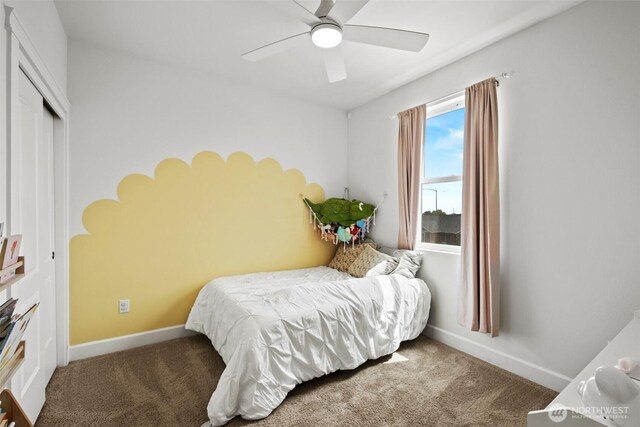 carpeted bedroom featuring a ceiling fan, baseboards, and a closet