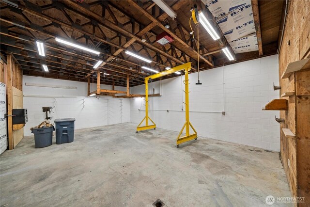 garage with concrete block wall