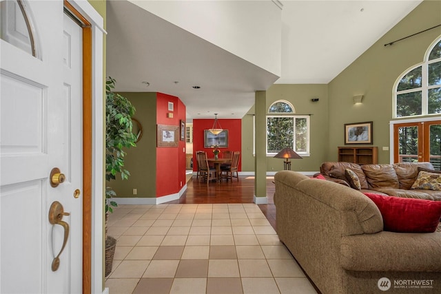 living room featuring light tile patterned flooring and baseboards