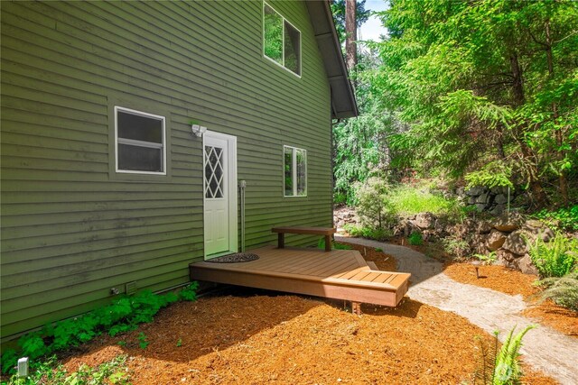 rear view of property with a deck