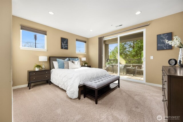bedroom featuring light colored carpet, recessed lighting, baseboards, and access to exterior