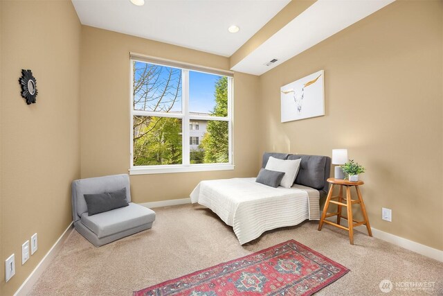 carpeted bedroom featuring recessed lighting, baseboards, and visible vents
