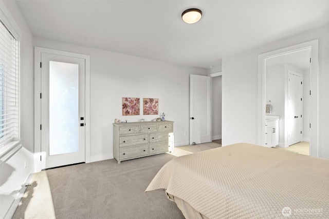 bedroom featuring baseboards and light colored carpet
