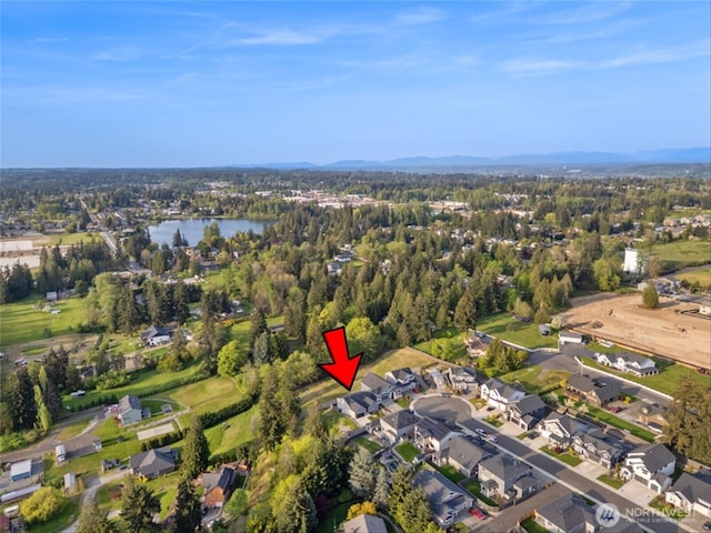 birds eye view of property with a water view and a residential view