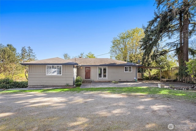 ranch-style house with fence and french doors