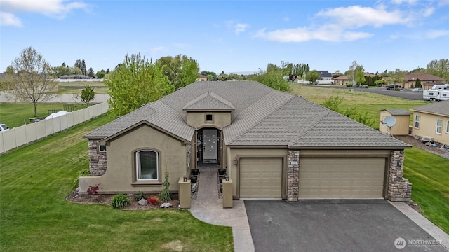 view of front facade featuring a garage, a front lawn, stucco siding, and driveway