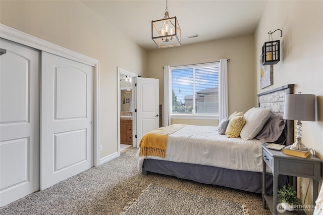 bedroom featuring baseboards, a notable chandelier, carpet flooring, and visible vents