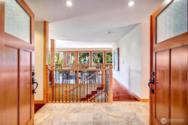 entryway with recessed lighting and baseboards
