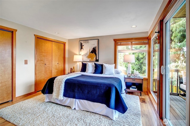 bedroom with recessed lighting, visible vents, and light wood-style flooring