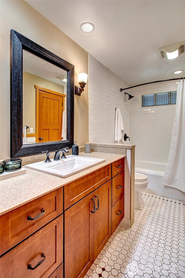 full bathroom featuring shower / bathtub combination with curtain, toilet, and vanity