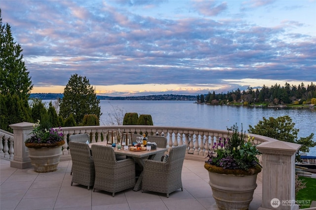 3602 Evergreen Point Rd, Medina, WA 98039 - patio terrace at dusk with outdoor dining area and a water view