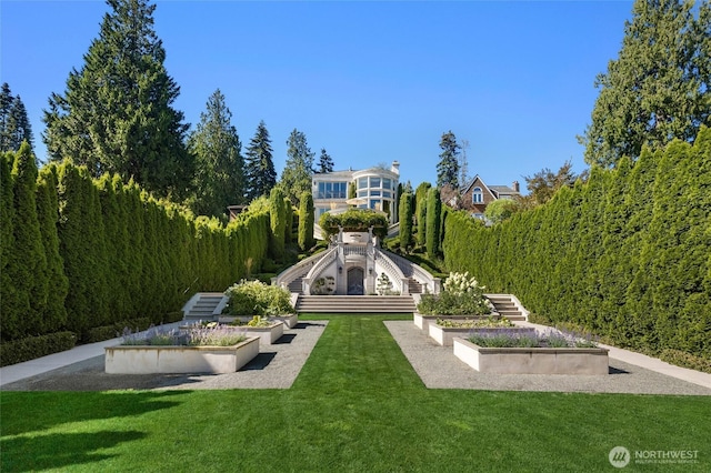 3602 Evergreen Point Rd, Medina, WA 98039 - exterior space with a lawn, a view of trees, stairs, and a vegetable garden