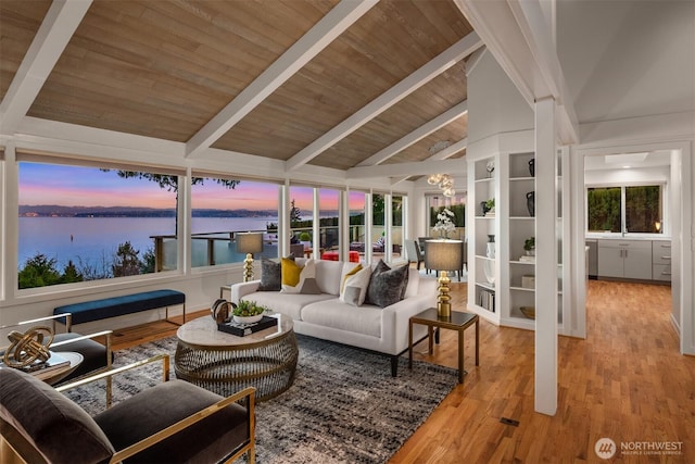 10837 Bill Point Blf NE, Bainbridge Island, WA 98110 - sunroom / solarium featuring a water view and beam ceiling