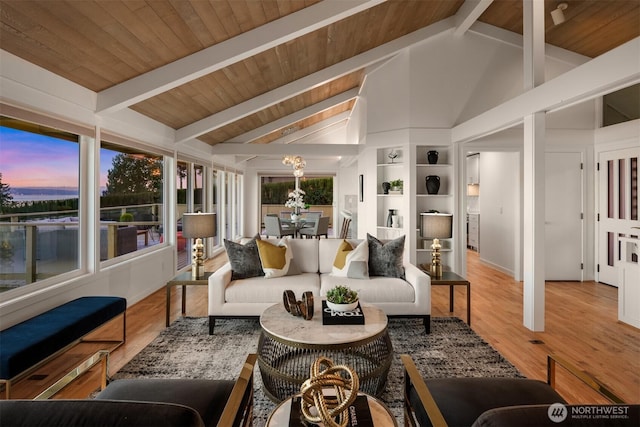 10837 Bill Point Blf NE, Bainbridge Island, WA 98110 - sunroom with a chandelier and beamed ceiling