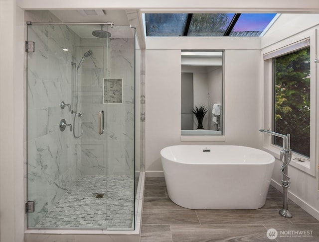 10837 Bill Point Blf NE, Bainbridge Island, WA 98110 - full bathroom with a freestanding bath, baseboards, and a marble finish shower