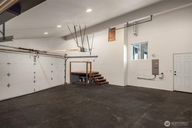 10837 Bill Point Blf NE, Bainbridge Island, WA 98110 - garage featuring a garage door opener, recessed lighting, and electric panel