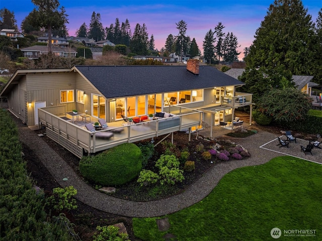 10837 Bill Point Blf NE, Bainbridge Island, WA 98110 - rear view of house featuring a yard, a deck, a chimney, and roof with shingles