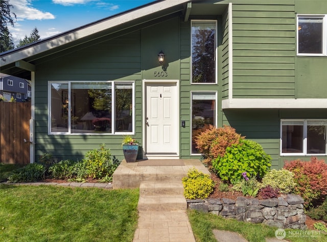 view of front of house with fence