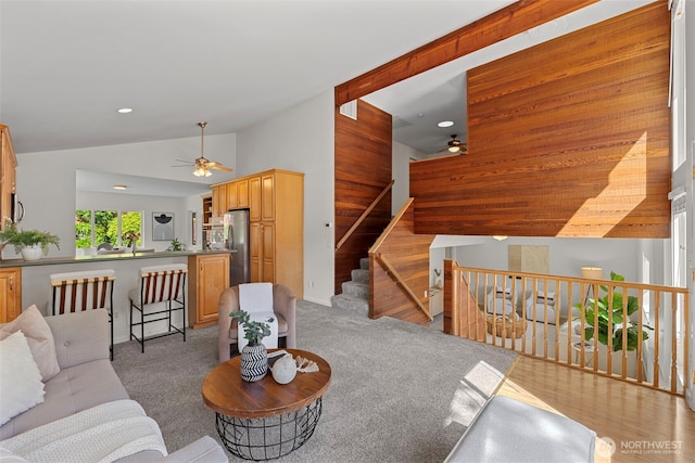 carpeted living area featuring recessed lighting, ceiling fan, and lofted ceiling
