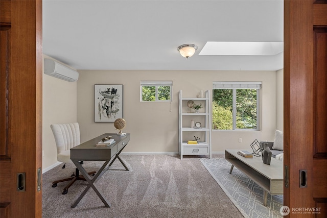 office area featuring an AC wall unit, carpet, baseboards, and a skylight