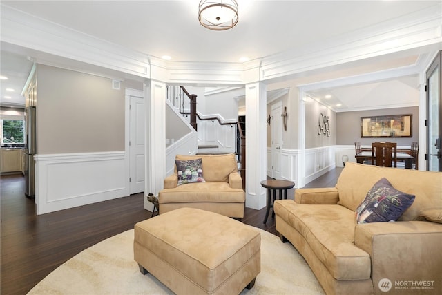 26217 137th Street Ct E, Buckley, WA 98321 - living room featuring ornamental molding, a decorative wall, wood finished floors, recessed lighting, and a wainscoted wall