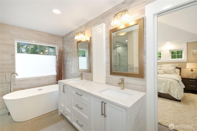 26217 137th Street Ct E, Buckley, WA 98321 - ensuite bathroom with a sink, tile walls, and ensuite bath