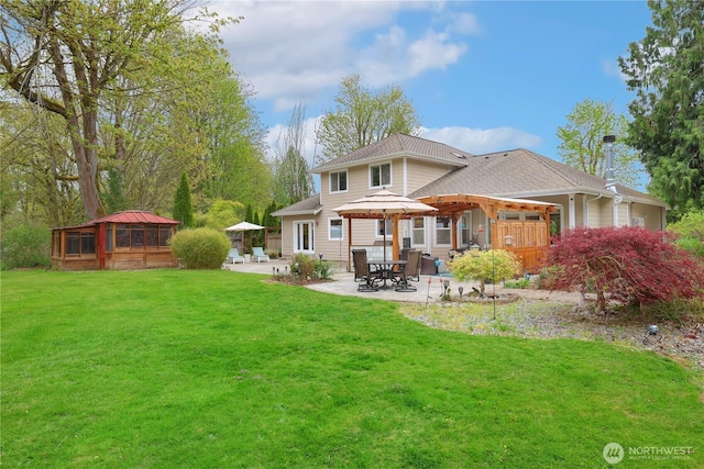 26217 137th Street Ct E, Buckley, WA 98321 - back of house with a lawn, a shingled roof, and a patio area